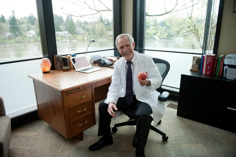 Dr. Noel Peterson in his office overlooking the water